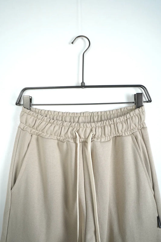 Tuta garzata over fondo stretto beige